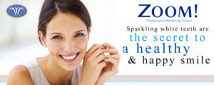 The image is a vibrant advertisement for Zoom teeth whitening services, featuring a woman with radiantly white teeth and the text  The secret to a healthy   happy smile .